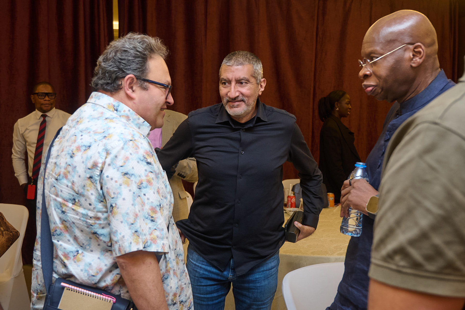 Launch guests exchanging ideas during a networking conversation